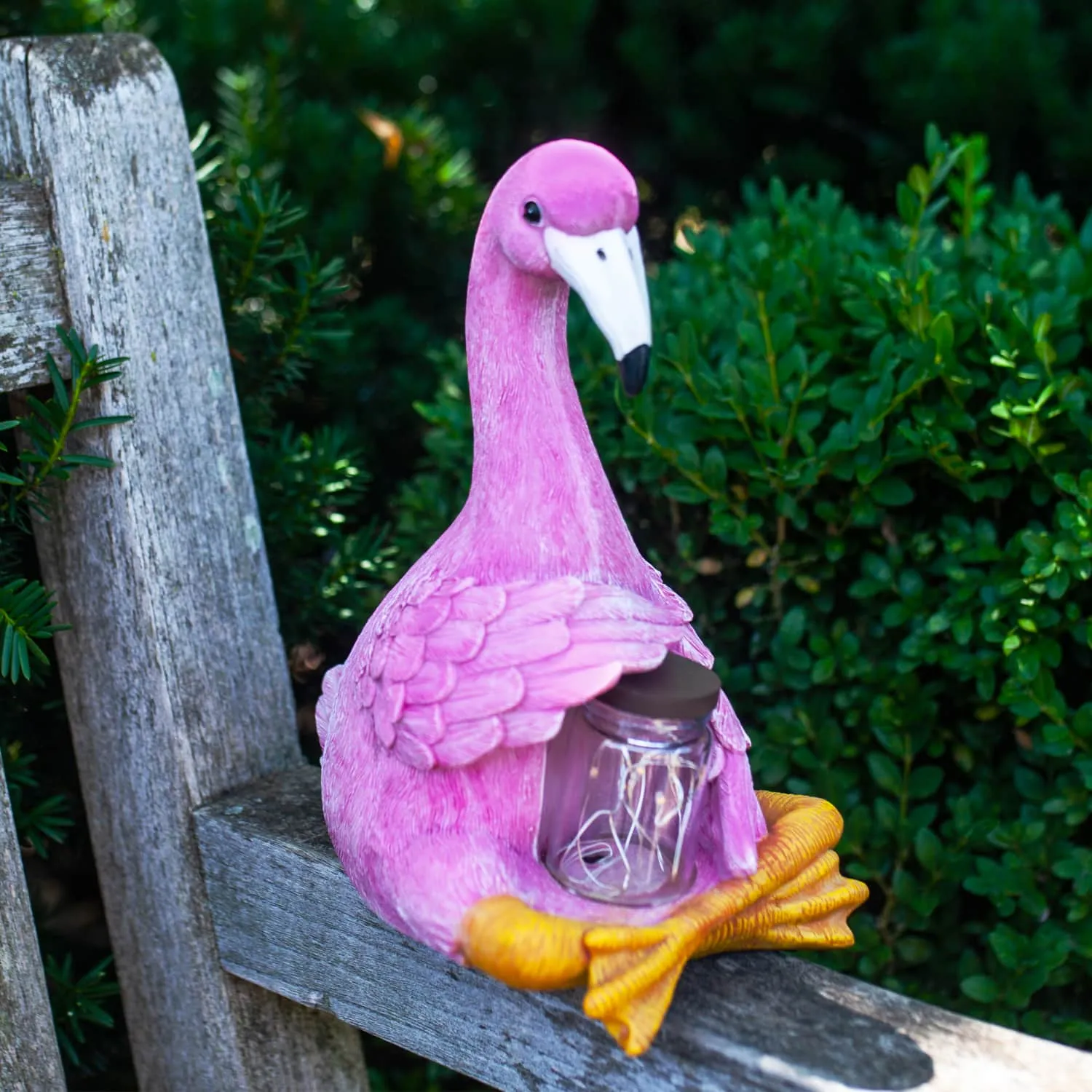 Solar Sitting Flamingo Garden Statue Holding a Glass Jar with Six LED Firefly String Lights